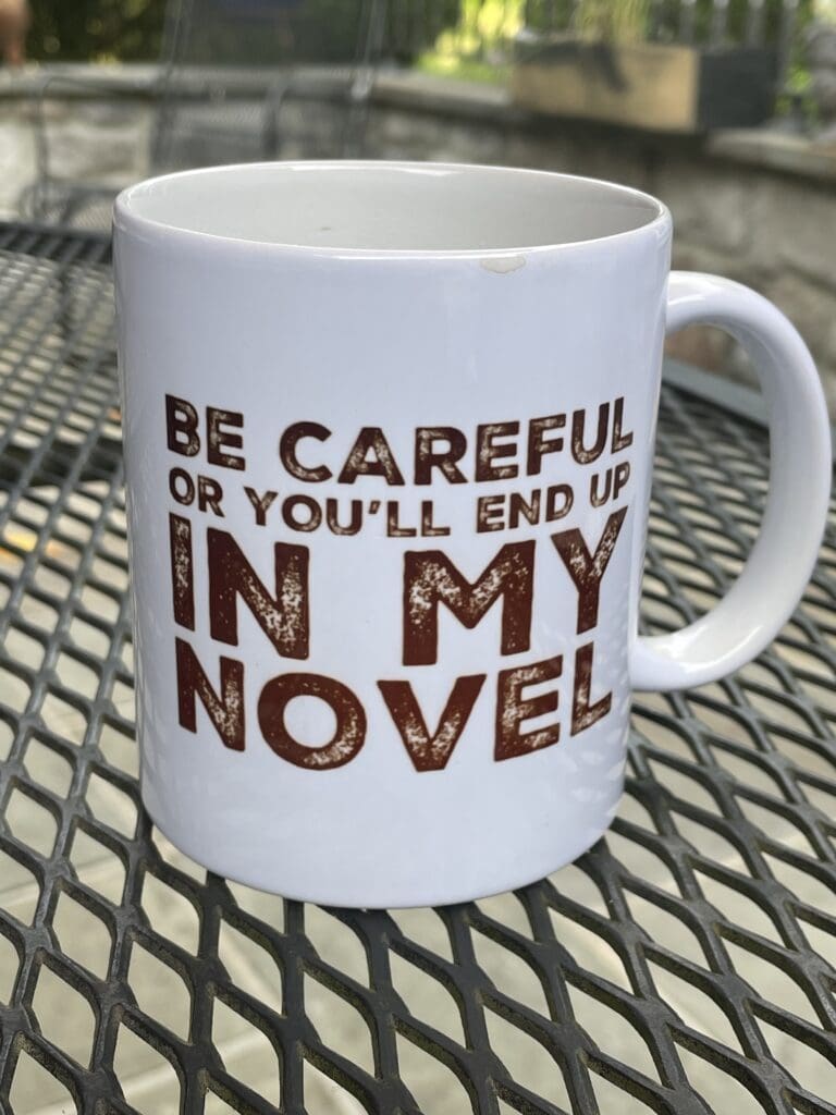 A Coffee Mug in White Color With an Author Quote